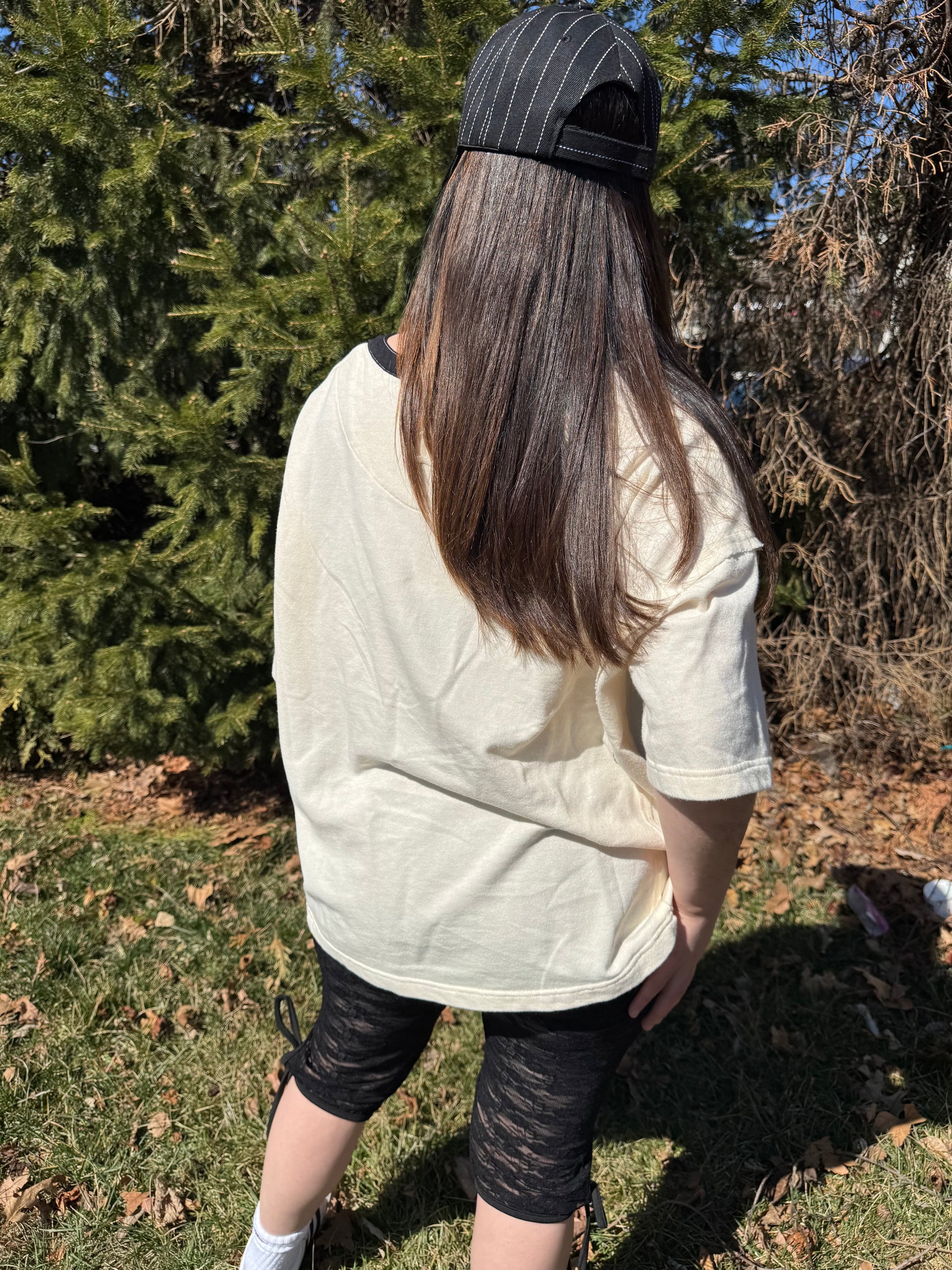 Elevate your everyday wardrobe with this stylish and comfortable cotton vanilla  creme tee. Features a Terry cotton blend fabrication and black denim contrast accents with functional buttons. Vintage style wash. 100% COTTON