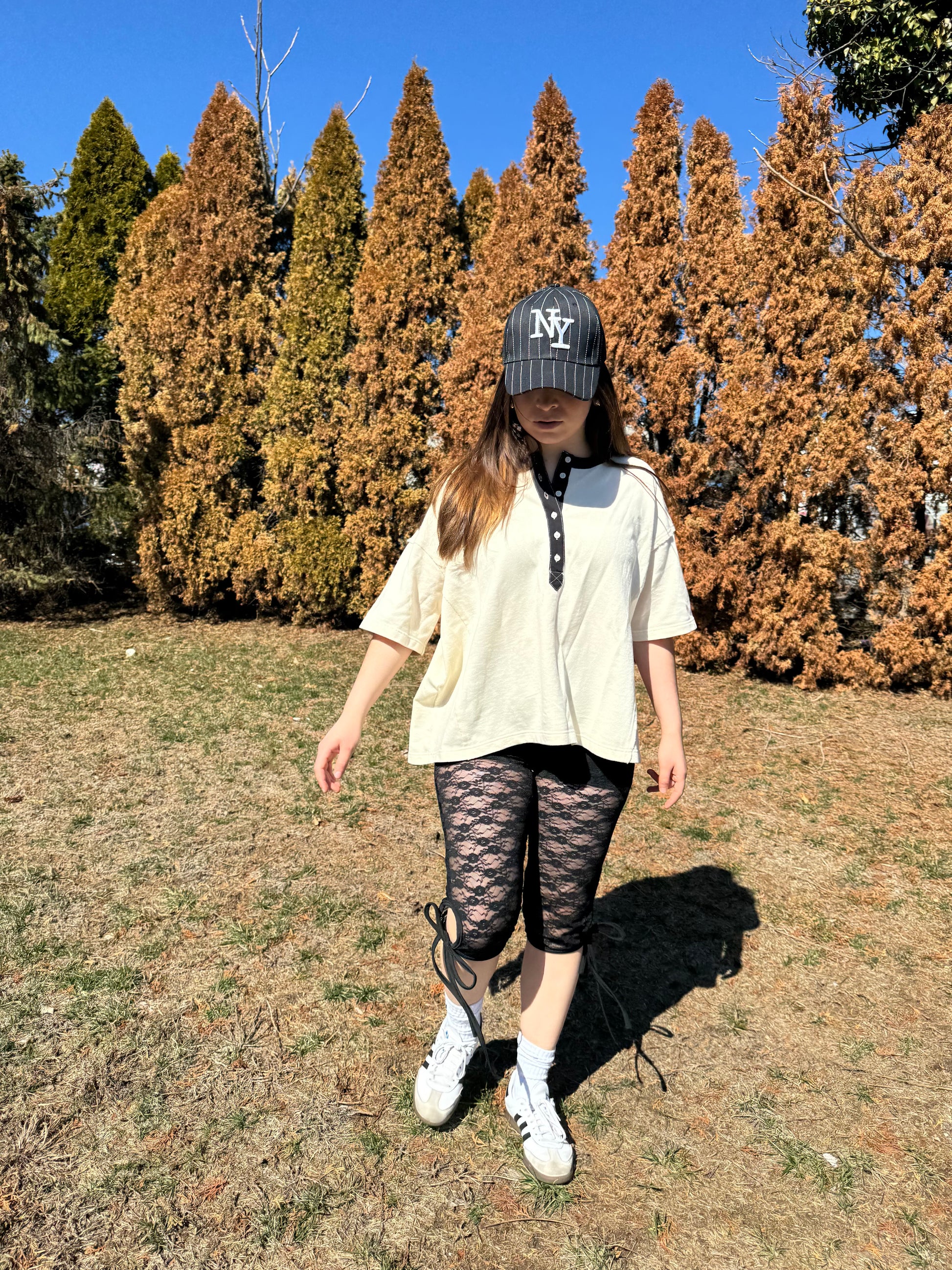 Elevate your everyday wardrobe with this stylish and comfortable cotton vanilla  creme tee. Features a Terry cotton blend fabrication and black denim contrast accents with functional buttons. Vintage style wash. 100% COTTON