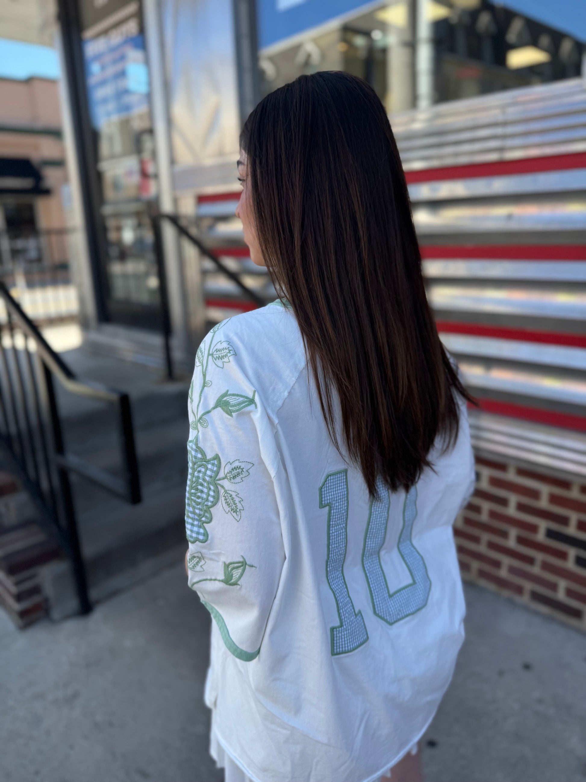  vintage '60's oversized t-shirt inspired with a cotton garment washed fabrication. Raglan sleeves for a cool relaxed fit. Count on a mixed media appliqué on sleeves and a gingham jersey numbered appliqué on back. 100% COTTON