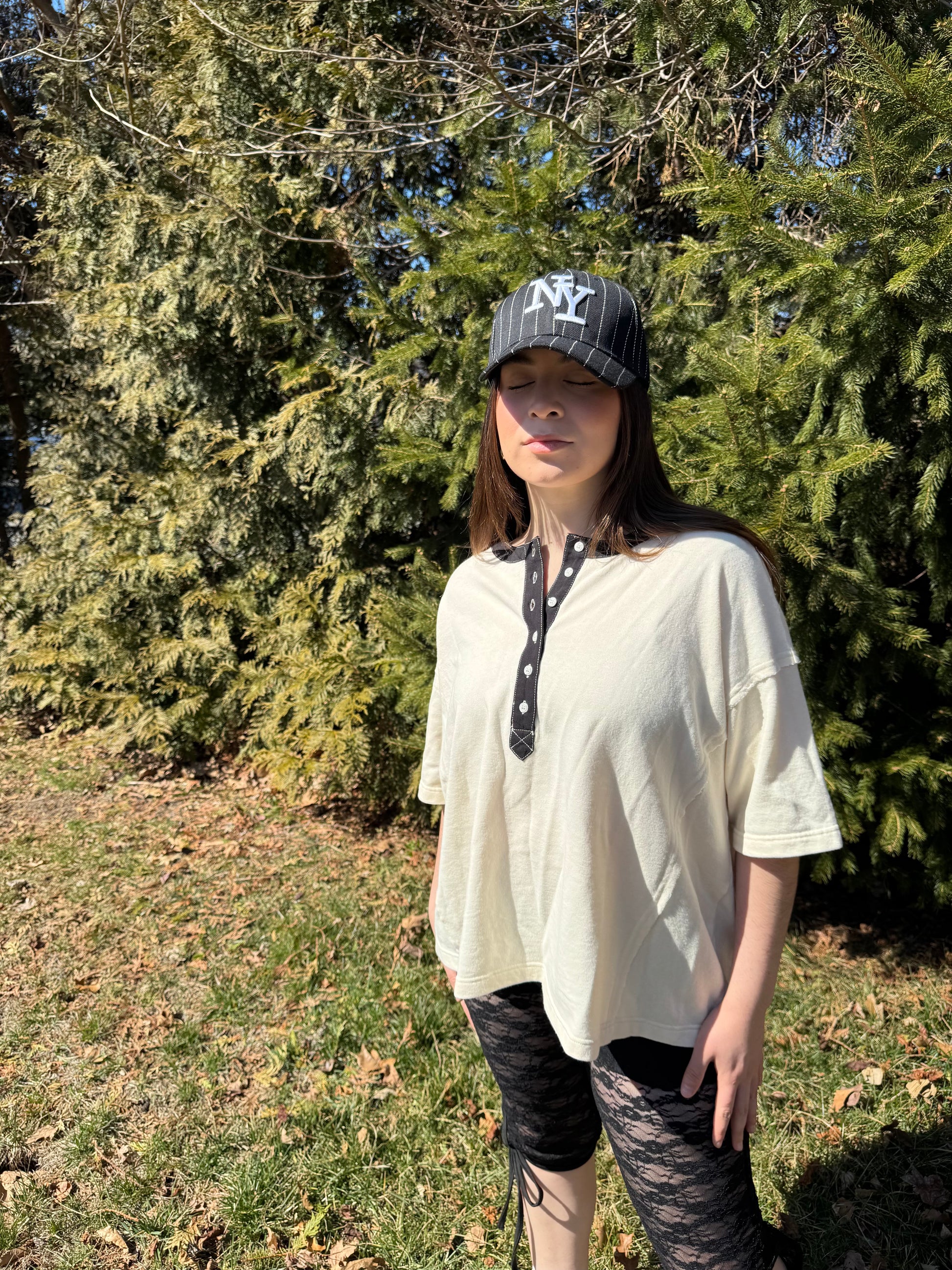 Stylish and comfortable cotton vanilla  creme tee. Features a Terry cotton blend fabrication and black denim contrast accents with functional buttons. Vintage style wash. 100% COTTON